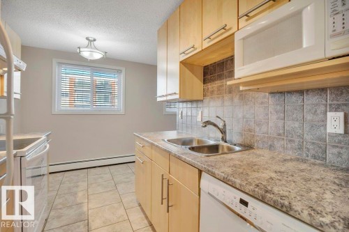 105 10149 83 Avenue, Edmonton, AB - Indoor Photo Showing Kitchen With Double Sink