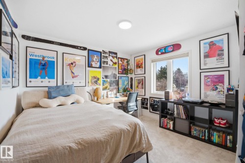 This room features a window providing natural light, carpeted flooring, and a ceiling light fixture - 7235 112 Street, Edmonton, AB - Indoor Photo Showing Bedroom