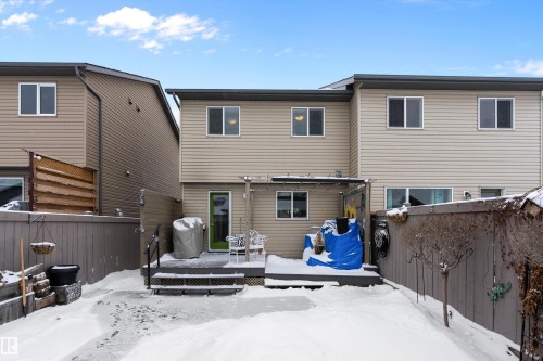 The property features a fenced yard with a deck and direct access to the interior through a door - 2914 18A Avenue, Edmonton, AB - Outdoor With Deck Patio Veranda With Exterior