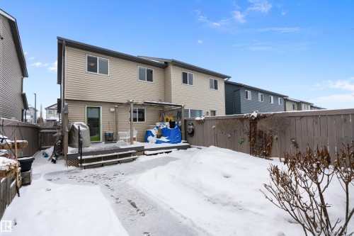 The property features a backyard with a deck and a privacy fence - 2914 18A Avenue, Edmonton, AB - Outdoor With Deck Patio Veranda With Exterior