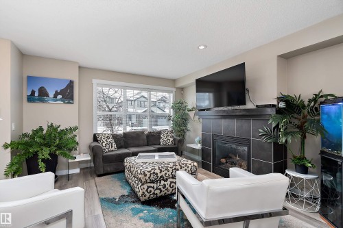 2914 18A Avenue, Edmonton, AB - Indoor Photo Showing Living Room With Fireplace