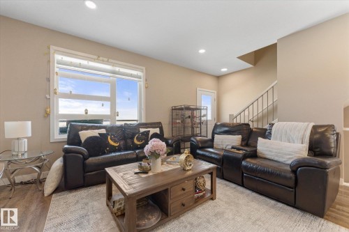Inviting living space featuring recessed lighting, a large window, and light-colored walls - 79 17635 58 Street, Edmonton, AB - Indoor Photo Showing Living Room
