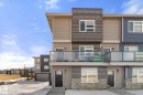 The property features a modern exterior with varied siding textures and colors, including stone accents - 79 17635 58 Street, Edmonton, AB  - Outdoor With Balcony 