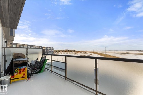 The property includes a spacious balcony with frosted glass railings - 79 17635 58 Street, Edmonton, AB - Outdoor With Balcony With View