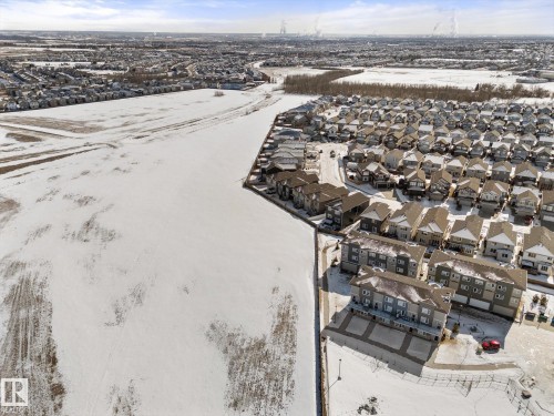 Aerial view of a residential neighbourhood with a variety of property types, including townhouses and detached homes - 79 17635 58 Street, Edmonton, AB - Outdoor With View