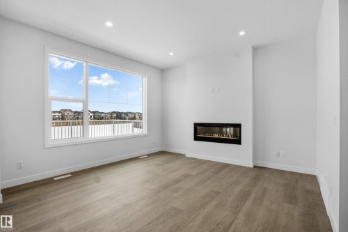 3924 Chrustawka Place, Edmonton, AB - Indoor Photo Showing Living Room With Fireplace
