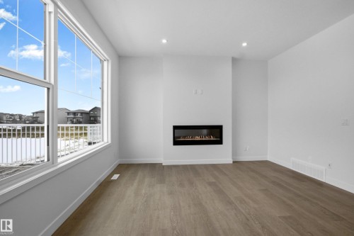 3924 Chrustawka Place, Edmonton, AB - Indoor Photo Showing Other Room With Fireplace