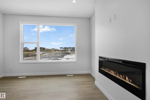 3924 Chrustawka Place, Edmonton, AB - Indoor Photo Showing Living Room With Fireplace