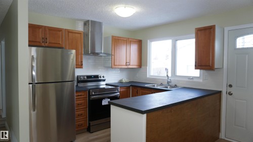 12924 135A Avenue, Edmonton, AB - Indoor Photo Showing Kitchen With Double Sink