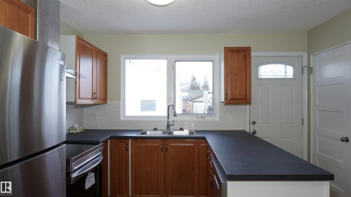12924 135A Avenue, Edmonton, AB - Indoor Photo Showing Kitchen With Double Sink
