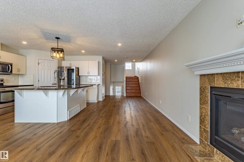 21326 61 Avenue, Edmonton, AB - Indoor Photo Showing Kitchen With Fireplace With Upgraded Kitchen