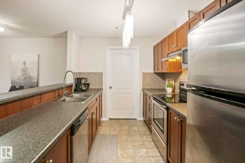1123 9363 Simpson Drive, Edmonton, AB - Indoor Photo Showing Kitchen With Stainless Steel Kitchen With Double Sink