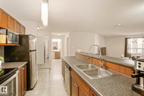 1123 9363 Simpson Drive, Edmonton, AB - Indoor Photo Showing Kitchen With Double Sink