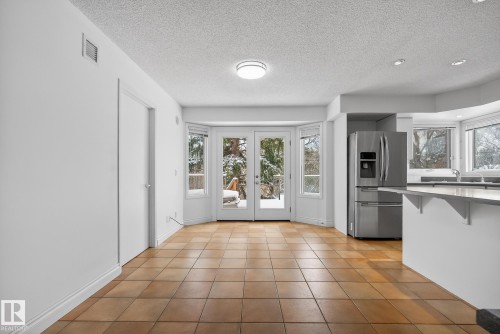 Garden Doors off Kitchen - 9115 77 Avenue, Edmonton, AB - Indoor Photo Showing Kitchen