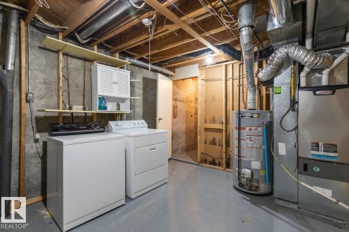 This area of the property includes laundry appliances, a water heater, and a furnace - 242 Primrose Gardens, Edmonton, AB - Indoor