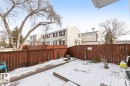 The property features a fenced yard with a gate, offering privacy - 242 Primrose Gardens, Edmonton, AB  - Outdoor 