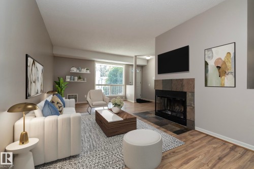 23 14620 26 Street, Edmonton, AB - Indoor Photo Showing Living Room With Fireplace