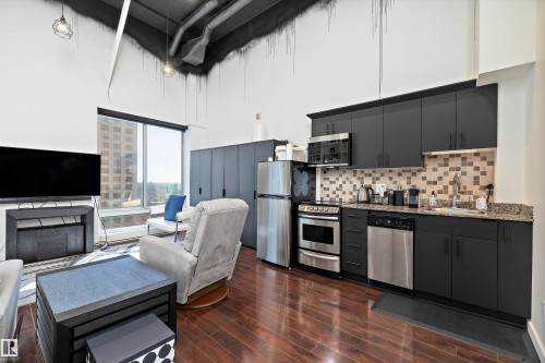 1810 10024 Jasper Avenue, Edmonton, AB - Indoor Photo Showing Kitchen With Fireplace