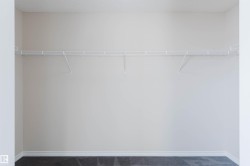 This space features a wall-mounted wire shelving system, providing practical storage - 