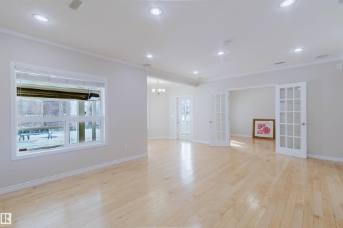 Bright and spacious room featuring light-colored hardwood flooring, recessed lighting, and white trim - 1135 112 Street, Edmonton, AB - Indoor Photo Showing Other Room