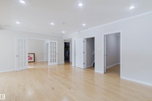 Spacious interior featuring light hardwood flooring, recessed lighting, and white trim - 1135 112 Street, Edmonton, AB - Indoor Photo Showing Other Room