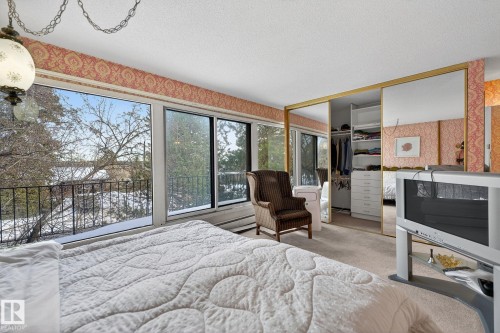 16 Laurier Place, Edmonton, AB - Indoor Photo Showing Bedroom With Fireplace