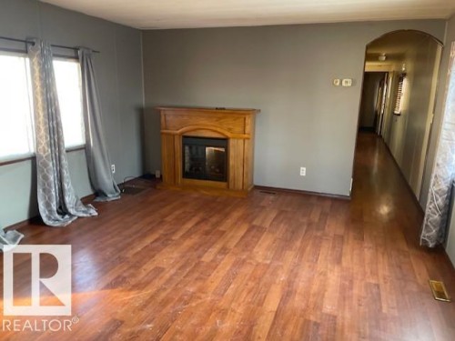 12 Cliff Crescent, Edmonton, AB - Indoor Photo Showing Living Room With Fireplace