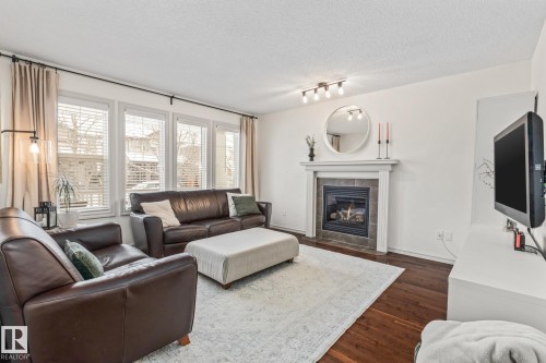 1133 35A Avenue, Edmonton, AB - Indoor Photo Showing Living Room With Fireplace