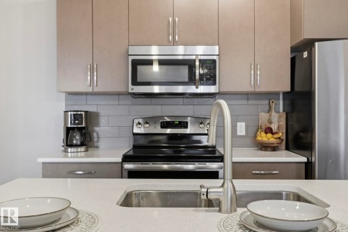303 320 Ambleside Link Drive, Edmonton, AB - Indoor Photo Showing Kitchen With Double Sink With Upgraded Kitchen