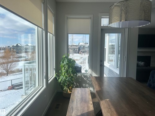 Living area with large windows providing extensive views - 5333 21A Avenue, Edmonton, AB - Indoor Photo Showing Other Room