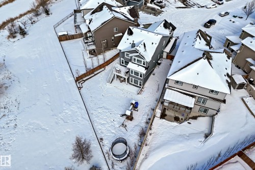 Aerial view of the property and surrounding neighborhood, featuring a sloped yard and a multi-level deck - 5333 21A Avenue, Edmonton, AB - Outdoor