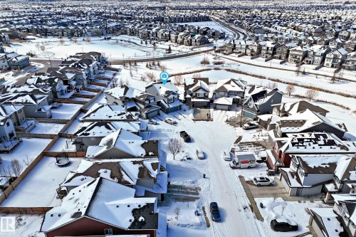 Aerial view showcasing a residential area with properties featuring snow-covered roofs - 5333 21A Avenue, Edmonton, AB - Outdoor With View
