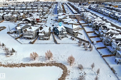 Aerial view of the property and its surrounding neighborhood, showcasing numerous homes with snow-covered rooftops - 5333 21A Avenue, Edmonton, AB - Outdoor With View