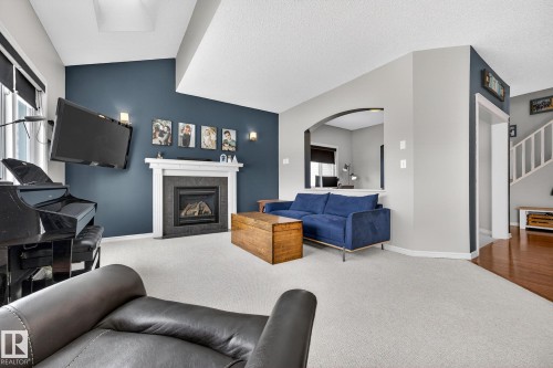 112 Windrose Drive, Leduc, AB - Indoor Photo Showing Living Room With Fireplace
