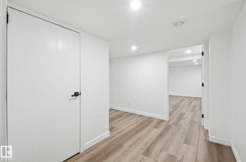 Basement hallway leading to two extra bedrooms. - 2722 104A Street, Edmonton, AB - Indoor Photo Showing Other Room
