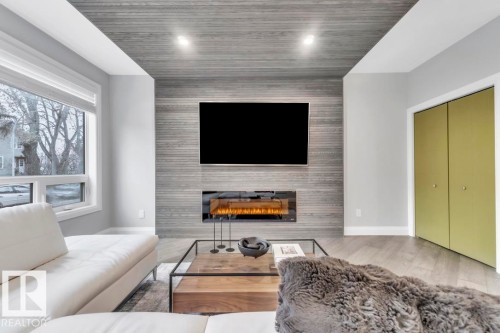 8617 108A Street, Edmonton, AB - Indoor Photo Showing Living Room With Fireplace