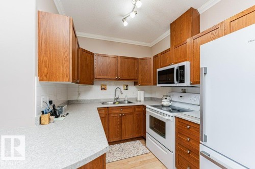 206 8528 82 Avenue, Edmonton, AB - Indoor Photo Showing Kitchen With Double Sink