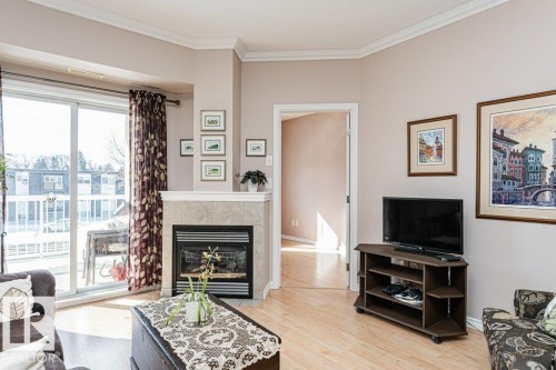 206 8528 82 Avenue, Edmonton, AB - Indoor Photo Showing Living Room With Fireplace