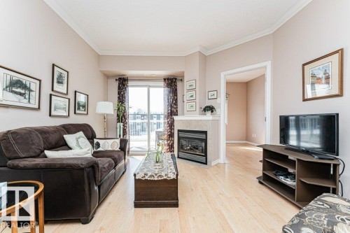 206 8528 82 Avenue, Edmonton, AB - Indoor Photo Showing Living Room With Fireplace
