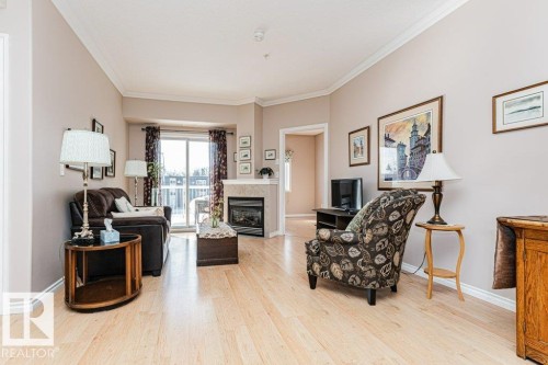 206 8528 82 Avenue, Edmonton, AB - Indoor Photo Showing Living Room With Fireplace