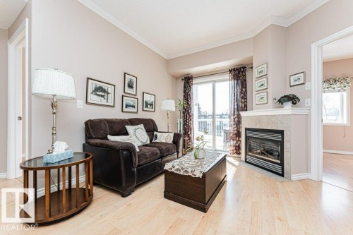206 8528 82 Avenue, Edmonton, AB - Indoor Photo Showing Living Room With Fireplace