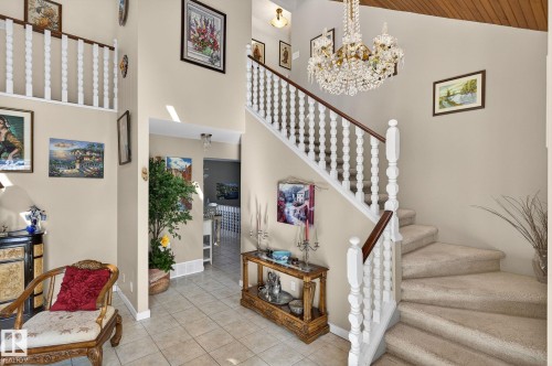 The property features a grand entryway with a sweeping staircase and a vaulted ceiling - 5604 174 Street, Edmonton, AB - Indoor Photo Showing Other Room