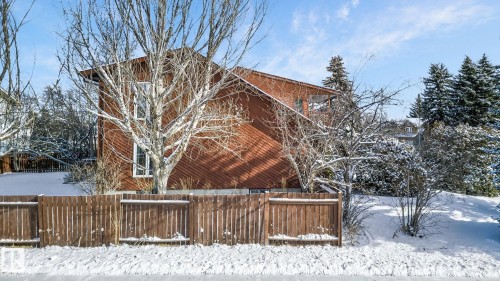 The property features a brown wooden exterior and a sloped roof - 5604 174 Street, Edmonton, AB - Outdoor