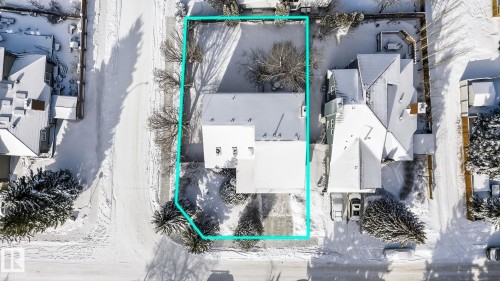 Aerial view of the property, featuring a snow-covered roof and a surrounding yard with bare trees - 5604 174 Street, Edmonton, AB - Outdoor