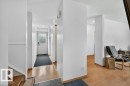 The property features a bright entryway with a white door, decorative glass, and a dark floor mat - 2655 89 Street, Edmonton, AB  - Indoor Photo Showing Other Room 