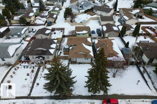 The property features a brown shingle roof and a beige exterior - 2655 89 Street, Edmonton, AB - Outdoor With View