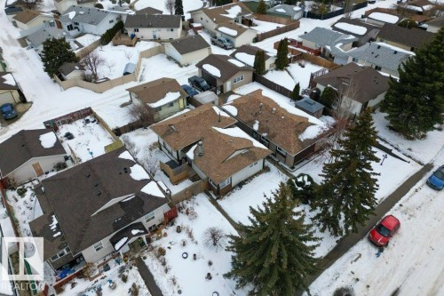 Aerial view of the neighborhood with snow-covered streets and rooftops - 2655 89 Street, Edmonton, AB - Outdoor With View