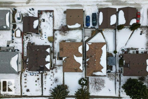 Aerial view of the property and its surrounding neighborhood, featuring residential homes with shingled roofs - 2655 89 Street, Edmonton, AB - Outdoor