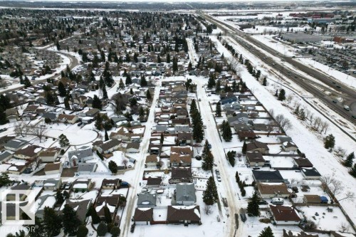 Aerial view showcasing a well-established residential area with an abundance of detached homes, featuring snow-covered roofs and yards - 2655 89 Street, Edmonton, AB - Outdoor With View