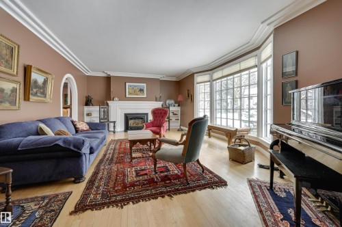 106 St George'S Crescent, Edmonton, AB - Indoor Photo Showing Living Room With Fireplace
